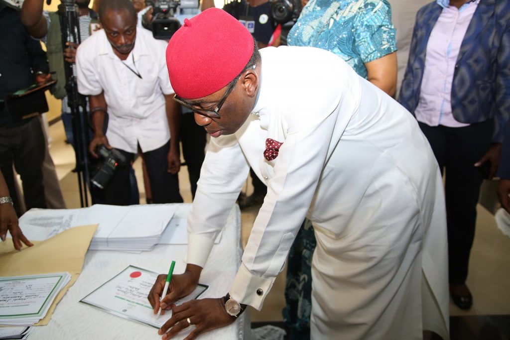Delta State Governor, Senator Ifeanyi Okowa Signing his Certificate of return, at INEC Delta State Headquarters, Asaba.