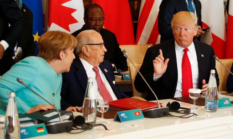 Trump talks to German Chancellor Merkel and Tunisia's President Essebsi at the G7 Summit expanded session in Taormina