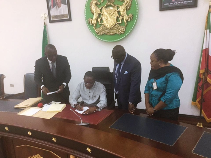 Okowa Signs Bills into Law