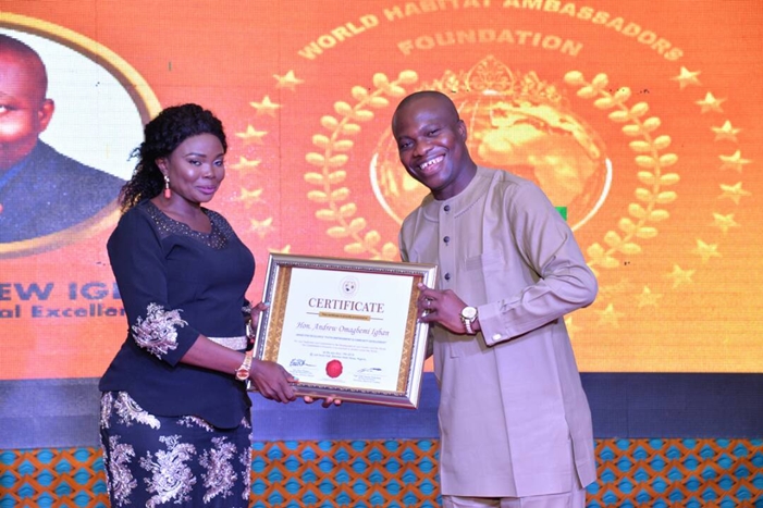 Hon Andrew Igban, Receiving an Award of Global Excellence and Certificate of Honours as World Habitat Leadership Conference Ambassador on Youth Empowerment and Community from Mrs Light Diden at Sheraton Hotels and Towers, Abuja