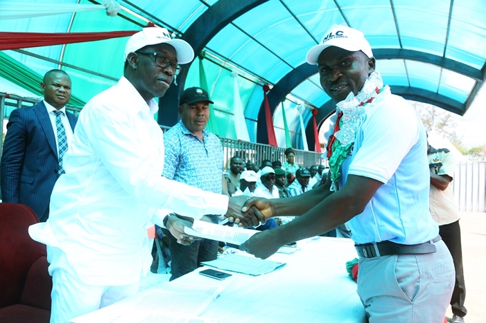 Delta State Governor, Senator Ifeanyi Okowa (left) receiving a letter of address from Comrade Jonathan Jemirieyigbe Chairman, Nigeria Labour Congress, Delta State during the 2018 International Workers Day Celebration, held at St. Patrick College Asaba, Delta State.