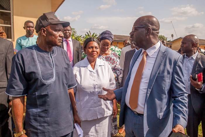 Edo State Governor, Mr. Godwin Obaseki (right); Chairman, Uhunmwode Local Government Council, Hon. Napoleon Agbama (left), during a tour of Uhunmwode Primary Healthcare Center in Ehor, Edo State.