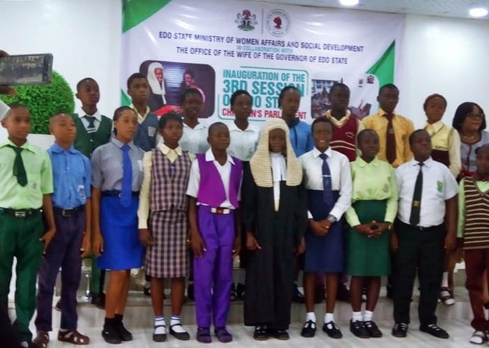Speaker, Edo State Children’s Parliament, Master Richard Asen (5th right), with other Principal members and other members of the Parliament during their inauguration at the Government House in Benin City.