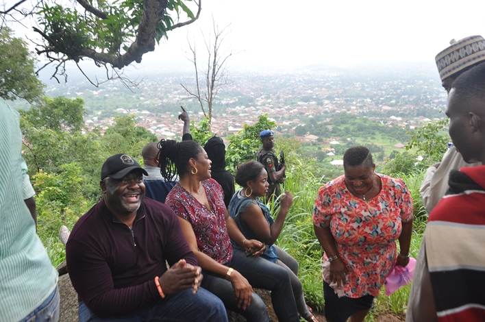 L-R: Commissioner for Arts, Culture, Tourism and Diaspora Affairs, Hon. Osazee Osemwingie-Ero; Vice Chairman, Etsako East Local Government Area, Princess Benedicta Attoh, and others, at the top of the Illewa Hill in Okpella, Estako East Local Government Area.