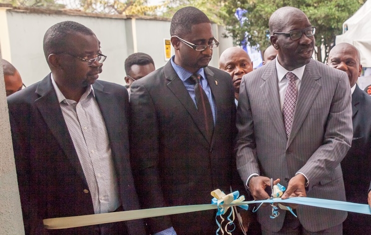 Edo State Governor, Mr. Godwin Obaseki (right), cutting the tape; flanked by Chief Executive Officer, Echolily Investment LLC, Dr. Austin Okogun (left); and Executive Director, Lily Hospital, Dr. Kimoni Ikutegbe (middle), during the commissioning of a GE 1.5 Tesla Magnetic Resonance Imaging (MRI) machine and a GE 64 Slice CT Scan Machine at Lily Hospital in Benin City, Edo State.
