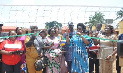 Miss Osayuwamen Aladeselu (2nd right) commissioning a volleyball court, built by beneficiaries of Federal Government's Social Investment programme, N-Power, at Eweka Primary School, Useh, in Egor Local Government Area, Edo State.