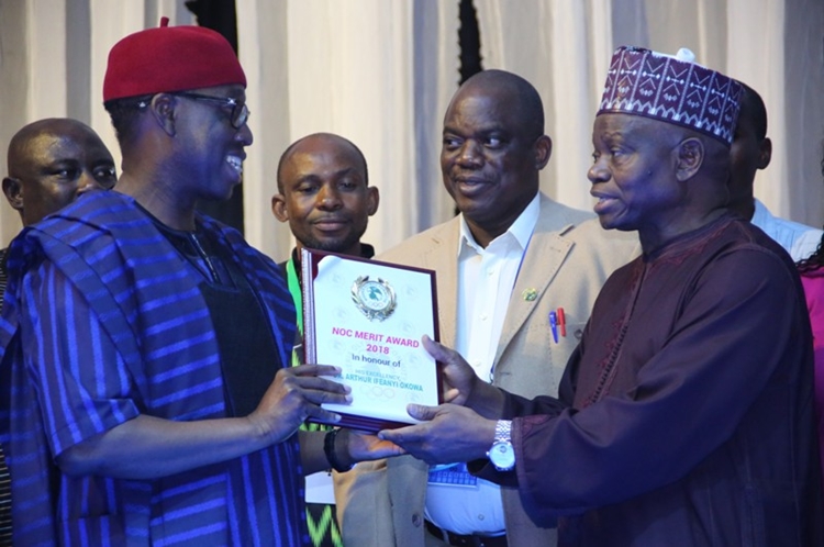 Delta State Governor, Senator Ifeanyi Okowa (left), receiving the National Olympic Committee Merit Award from it’s President, Engr. Habu Gumel, during the NOC 2018 Merit Award night in Asaba.