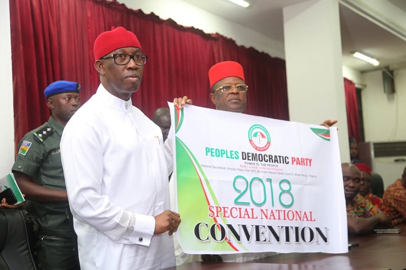 Delta State Governor, Senator Ifeanyi Okowa (left) and Governor of Ebonyi State, Engr. Dave Umahi , displaying the 2018 PDP Special National Convention Flag, at Wadata Plaza, Abuja.