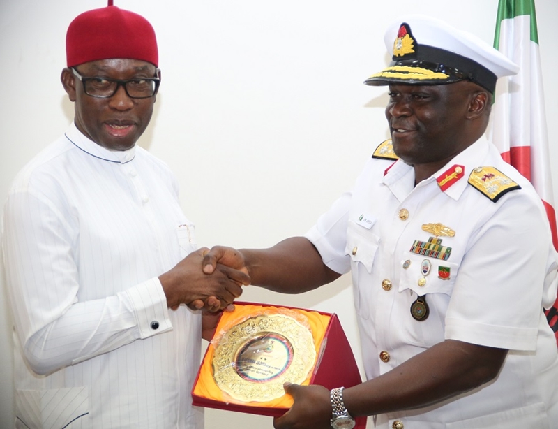 Delta State Governor, Senator Ifeanyi Okowa (left), receiving a plague from the Flag Officer Commanding, Nigerian Navy Logistics Command, Oghara, Rear Admiral Uchenna Onyia, during a courtesy call by the Flag Officer to the Governor in Asaba.