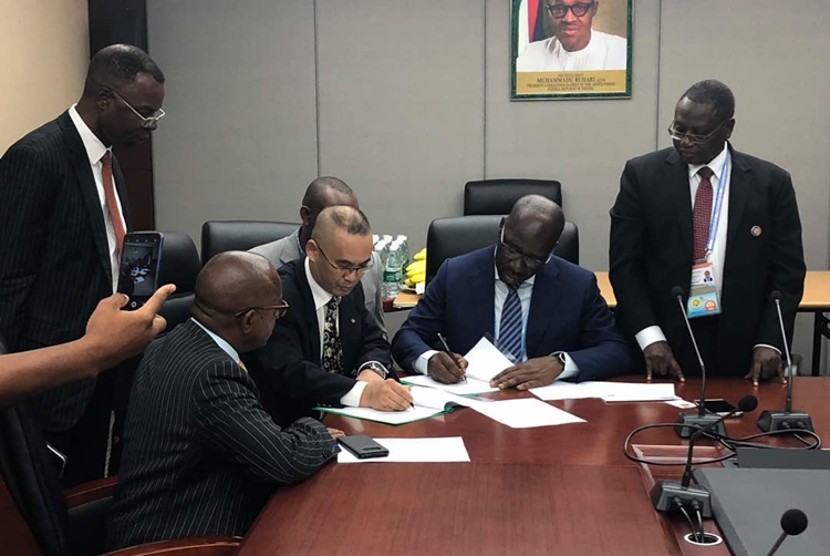 Sitting: Edo State Governor, Mr Godwin Obaseki (2nd right); and Mr Yang Hongtao of Peiyang Chemical Equipment Company of China (PCC) (2nd left); flanked by Nigerian officials at the signing of the investment agreement for the construction of a modular refinery in Benin City, in Beijing China.