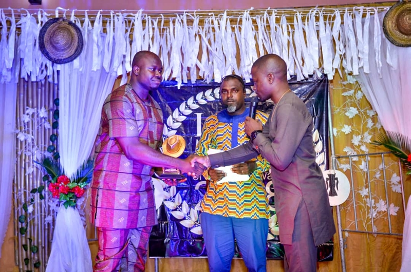Chairman, Macaulay Media Vanguard, MMV, Mr Iteveh Ekpokpobe, (left) receiving the award on behalf of Comrade Ovuozourie Macaulay.