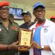 Delta State Governor, Senator Ifeanyi Okowa (right) receiving a Special Honors Award for Promoting Track and Field Athletics in the African Continent from Hon. Minister of Sport, Solomon Dalung, at the 2018, 19th National Sport Festival held in Abuja.