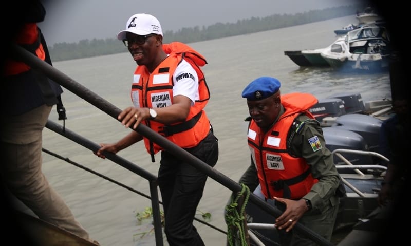 Delta State Governor, Senator Ifeanyi Okowa alighting from Military boat during the Party 2019 General Elections campaign at Burutu LGA
