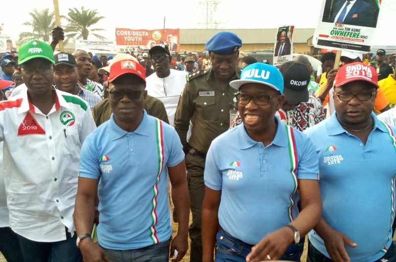 Delta State Governor, Senator Ifeanyi Okowa (2nd right), former Secretary to Delta State Government, Comrade Ovuozourie Macaulay acknowledging cheers from PDP faithfuls during the Campaign rally in Ozoro, Isoko North Local Council. PIX: GOODLUCK EMEOFAGBE
