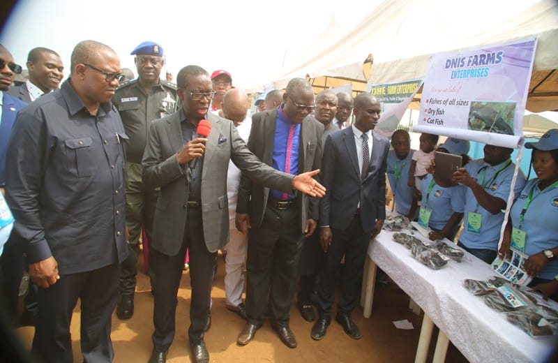 Delta State Governor, Senator Ifeanyi Okowa (2nd left), introducing some of the products to the Vice Presidential Candidate of the Peoples Democratic Party (PDP), Chief Peter Obi (left), during the Job Creation Exhibition in Asaba.