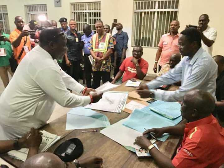 Chief Thomas Ereyitomi JP being handed his Winning Results