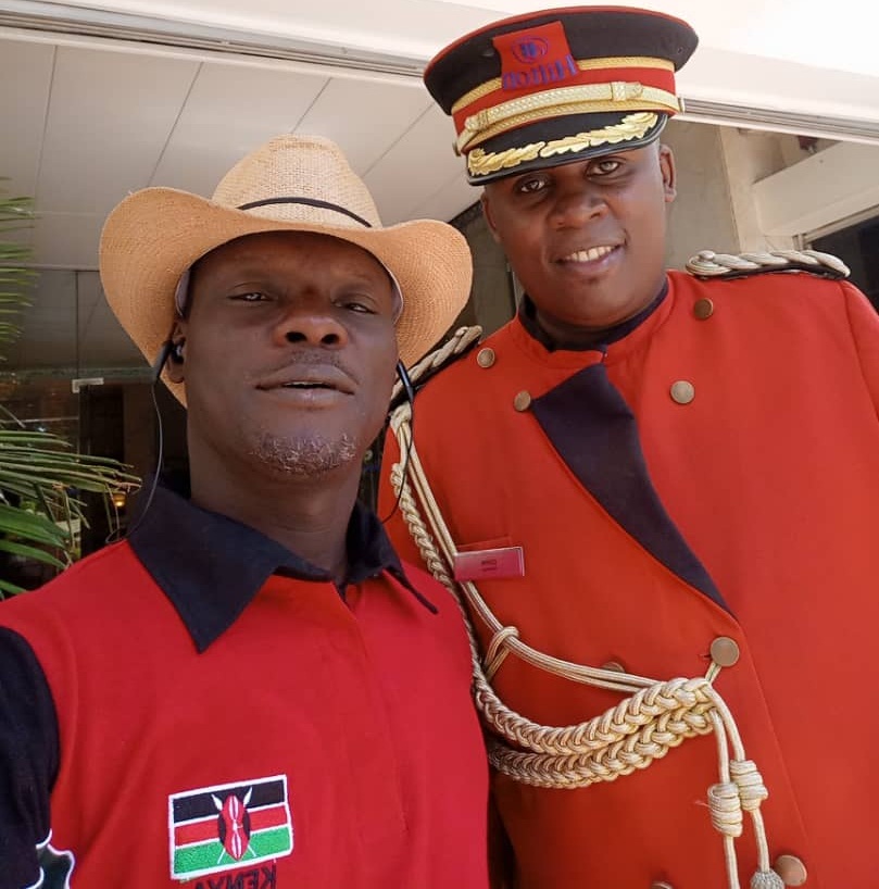 Comrade Sheriff Mulade (left) at a Conference in Kenya