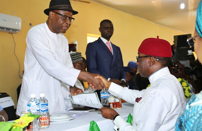 Delta State Governor, Senator Ifeanyi Okowa (right) receiving Governorship Certificate of return from the INEC National Commissioner, Dr. Mohammed Lecky, at INEC Delta State Conference Hall, Asaba.