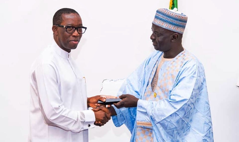 Delta State Governor, Senator Ifeanyi Okowa (left), presenting a souvenir to the Acting Director General of the National Institute and Strategic Studies Kuru, Jonathan Juma MNI during a courtesy call by the Participants of the Senior Executive Course 41 of NIPSS on the Governor in Asaba.