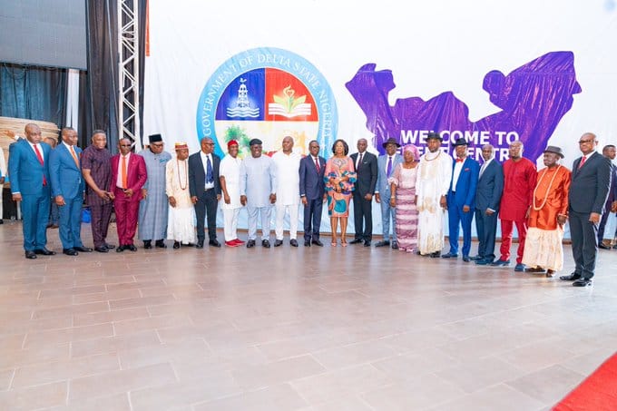 Governor Okowa flanked by newly sworn-in Commissioner Designates at Event Centre Asaba.