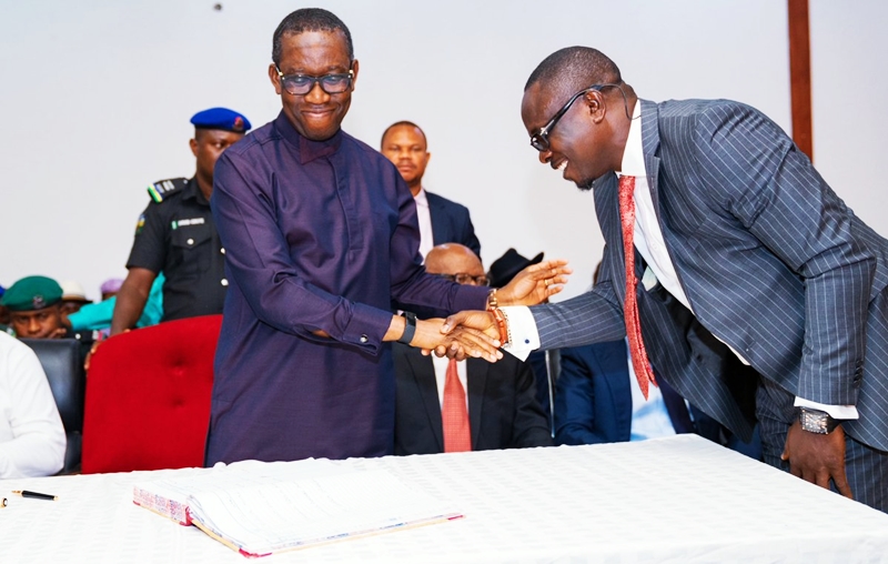 Delta state Governor, Senator Ifeanyi Okowa (left); congratulating Hon Efe Ofobruku, after been sworn-in as Special Adviser (Legislative Matters) to the Governor, in Government House Asaba, on July 2, 2019