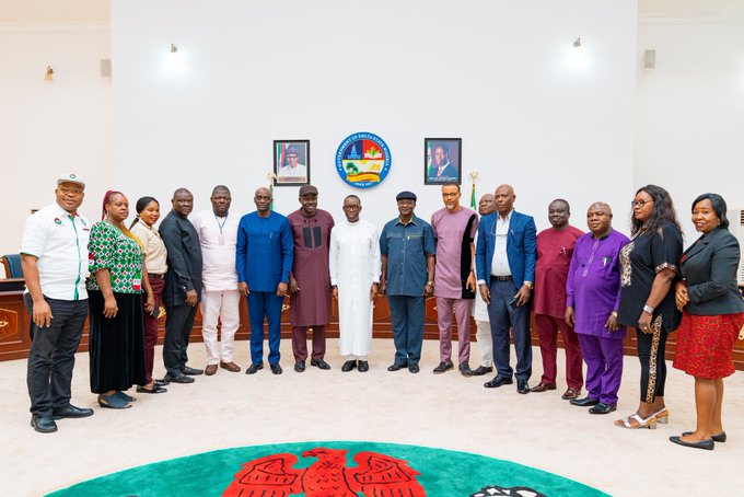 Delta State Governor, Senator Ifeanyi Okowa (middle) flanked during a courtesy call on the Governor, by the President of Nigeria Labour Congress, in Government House Asaba.