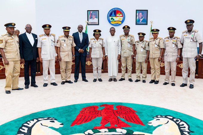 Delta State Governor, Senator Ifeanyi Okowa (6th right); Secretary to State Government, Mr. Chiedu Ebie (5th left); the Comptroller General of the Nigeria Immigration Service, Mohammad Babandede (5th right) and Others, during a courtesy call on the Governor, by the Comptroller General at Government House Asaba.
