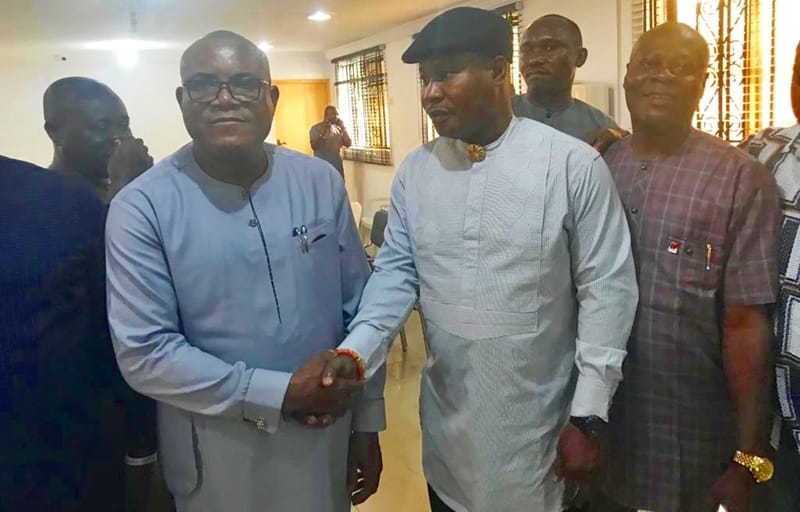 L-R: Chief Solomon Funkekeme, Senior Political Adviser to Governor Okowa and Chief Julius Takeme, Chairman, Delta South PDP in a Handshake