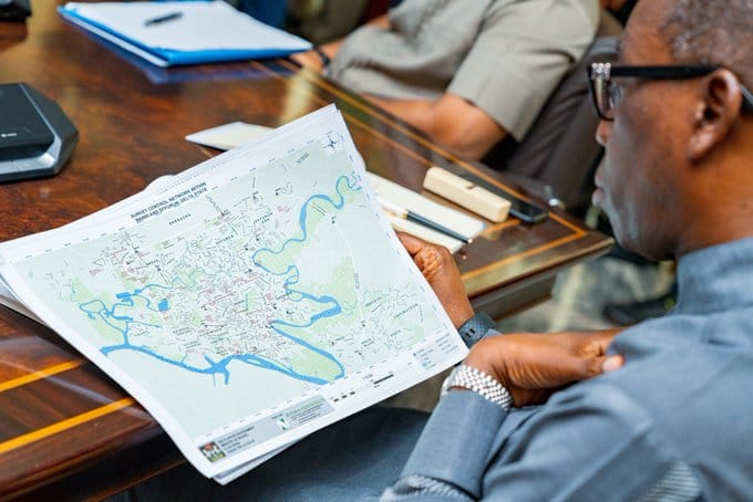 Governor Okowa Reading the Final Preliminary Report Of The Committee To Study And Advise Government On Measures Required To Tackle And Control Flooding Of Effurun/Warri And Its Environs In Delta State.