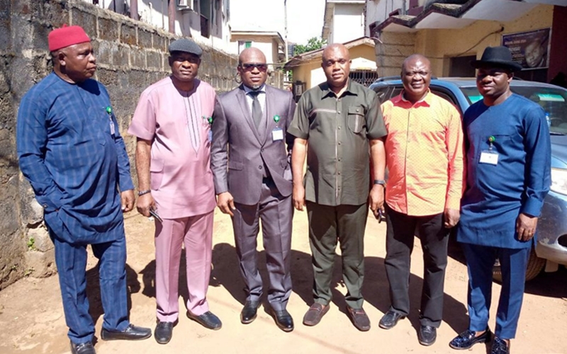 Delta Commissioner for Lands flanked by Chairman and Members of Delta Assembly Lands Committee during a courtesy visit to the Ministry