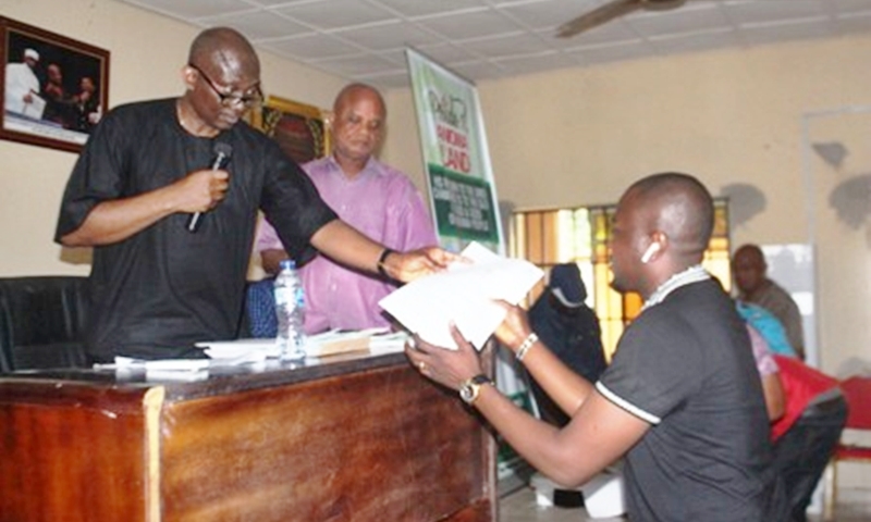 Rt. Hon Ndudi Elumelu, Minority leader of the Federal House of Representatives and member representing Aniocha/Oshimili Federal Constituency Issuing Appointment Letter to a Personal Assistant