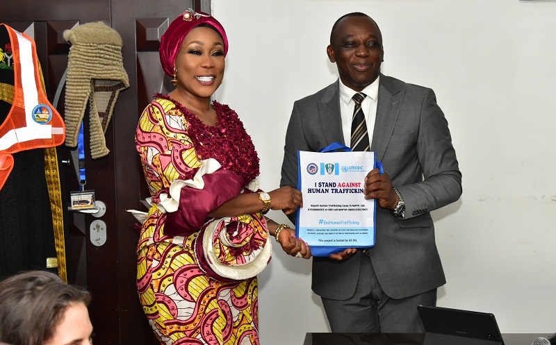 The Director-General of the National Agency for the Prohibition of Trafficking in Persons, Dame Julie Okah-Donli presenting a souvenir to the Chairman of the Delta State Task Force on Human Trafficking and Irregular Migration, Mr. Peter Mrakpor after an interactive session between the Agency and the Task Force on Monday, March 16, 2020 in Asaba
