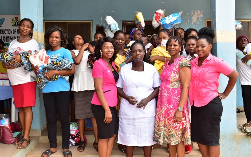 Coordinator, Mercygate Foundation, Barr. Lilian Eserinune (4th left), Matron of Oshimili South Local Government Primary Health Care Centre, Cablepoint (3rd right) with some nursing mothers during the distribution of relief materials by the NGO as part of the 2020 International Women's Day Celebration