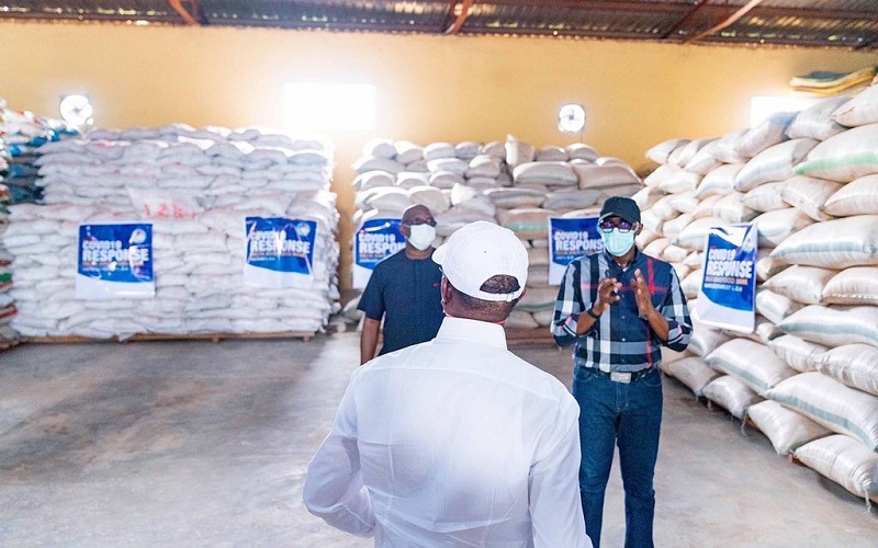 A Backshot of Delta Governor, Senator Dr. Ifeanyi Okowa while inspecting food items stored at the State’s Food Bank at Ibusa on Thursday, April 16, 2020 (Source: Twitter)