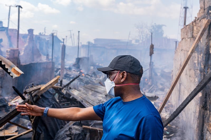 Governor Ifeanyi Okowa inspecting the burnt Ogbeogonogo market Asaba on Tuesday, May 26, 2020