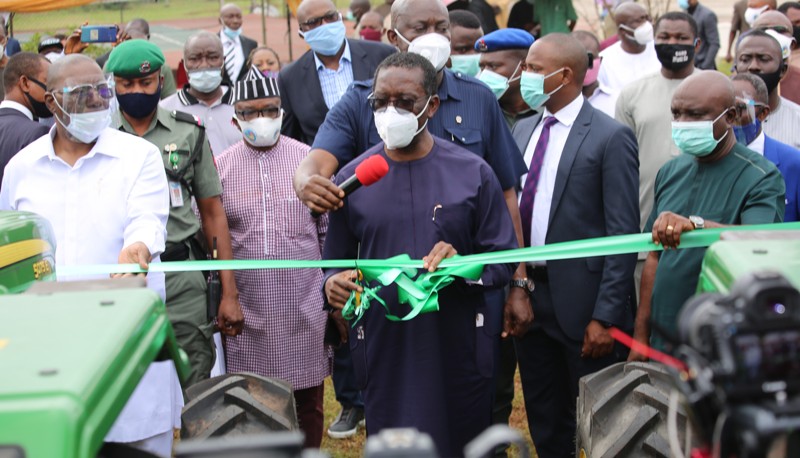 Delta Governor, Senator (Dr.) Ifeanyi Okowa (middle), flanked by his Deputy, Barr. Kingsley Otuaro (left), and the Commissioner for Agriculture, Hon Julius Egbedi (right), and others during the inauguration of Twenty Unit of Tractors and Farm implements for the enhancement of Agricultural activities in the State on Wednesday, September 2, 2020.