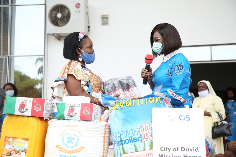 The wife of the Delta State Governor and founder O5 Initiative, Dame Edith Okowa (right) presenting food stuff to the representative of City of David Orphanage, Mrs. Angela Abiamuwe during the 2020 world orphans day celebration held in Government House, Asaba