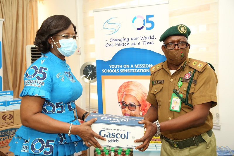 The wife of the Delta State Governor, founder O5 Initiative, Dame Edith Okowa (Left) presenting cartons of Drugs donated by O5 Initiative to the Deputy Comptroller, Friday Esezobor Ovie, Delta State Command, for the Five Correctional Centre in Delta State on Tuesday, December 8, 2020 (Pix: Norbert Amede)