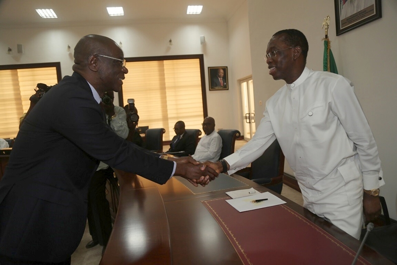 Delta Governor, Ifeanyi Okowa and Justice Vincent Ofesi Shaking Hands after Justice Ofesi's Inauguration as a Judge of the Delta State High Court on January 18, 2017