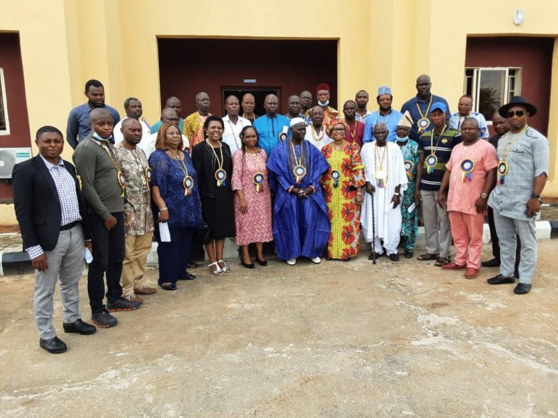  Management of NGC in a group photograph with members of Oben Community after the Commissioning aid handover of the civic Centre built by NGC for the community.