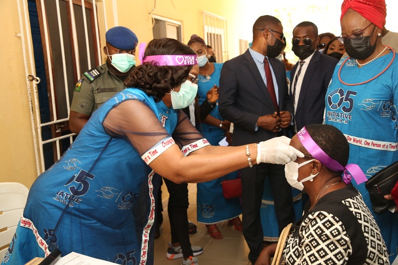 Wife of the Delta State Governor and Founder O5 Initiative, dame Edith Okowa (Left) presenting glasses to beneficiary of the medical outreach during the official flag-off of the O5 Initiative Free Grassroots Medical Outreach held at Central Hospital Oleh for Delta South. (PIX: NORBERT AMEDE)
