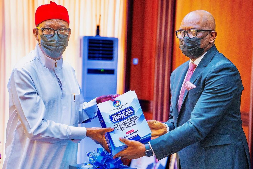 Delta Governor, Senator Dr. Ifeanyi Okowa (left), receiving the report of the Judicial Panel of Enquiry into the lingering intra-Communal crisis in Evwreni Community in Ughelli North LGA from the Chairman of the Panel, Hon. Justice Michael Obi report Government House, Asaba on Friday, March 18, 2022 (Pix: DTSG)