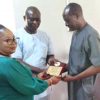 Alfred Ekpokpobe (right) Receiving the Association of Medical Laboratory Scientists of Nigeria Award