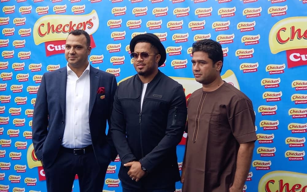 Nollywood Actor, Mike Ezuruonye (middle), Managing Director, Checkers Custard Limited, Mr. Karan Checkers (left) at the Unveiling of the Screen Actor as Brand Ambassador of Checkers Custard