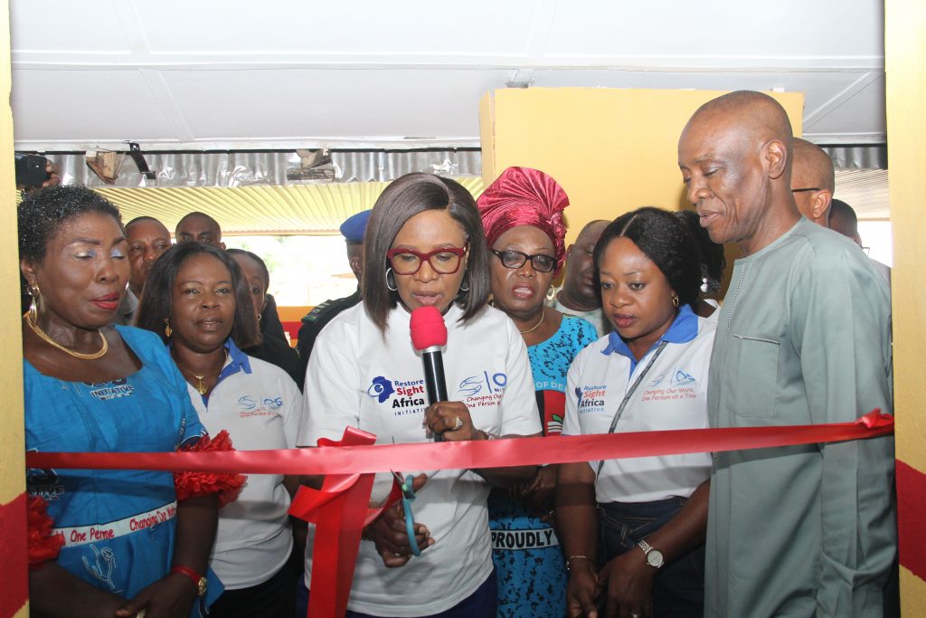 Wife of the delta state Governor and Founder O5 Initiative, Dame Edith (Middle) cutting the Tape to Inaugurate the 22nd Sickle Cell Clinic at General Hospital Ozoro during the flag off of the free grass root medical outreach organized for residence of Isoko Federal Constituency by O5 Initiative. PIX: NORBERT AMEDE