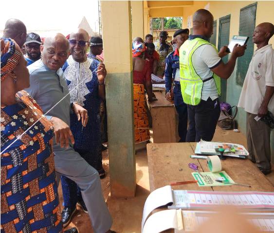 Hon Ndudi Elumelu (center) at the Polling Unit before casting his vote in the Saturday's Governorship and State assembly elections held on March 18, 2023