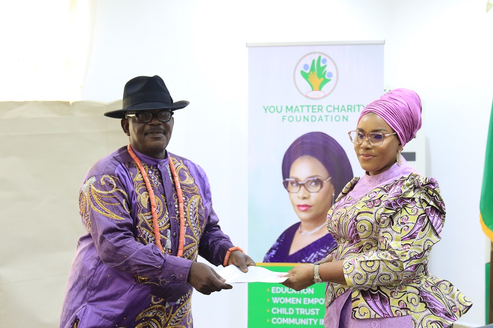 Wife of Delta Governor and Founder, You Matter Charity Foundation Deaconess Tobore Oborevwori (r) receiving a copy of address presented by the president, Evwreni community Improvement Union, Asaba Branch and Permanent Secretary, Office of the Secretary to the State Government, Comrade Samuel Diateke when he led members of the union on a courtesy visit to the First Lady’s Office (Pix: Norbert Amede)