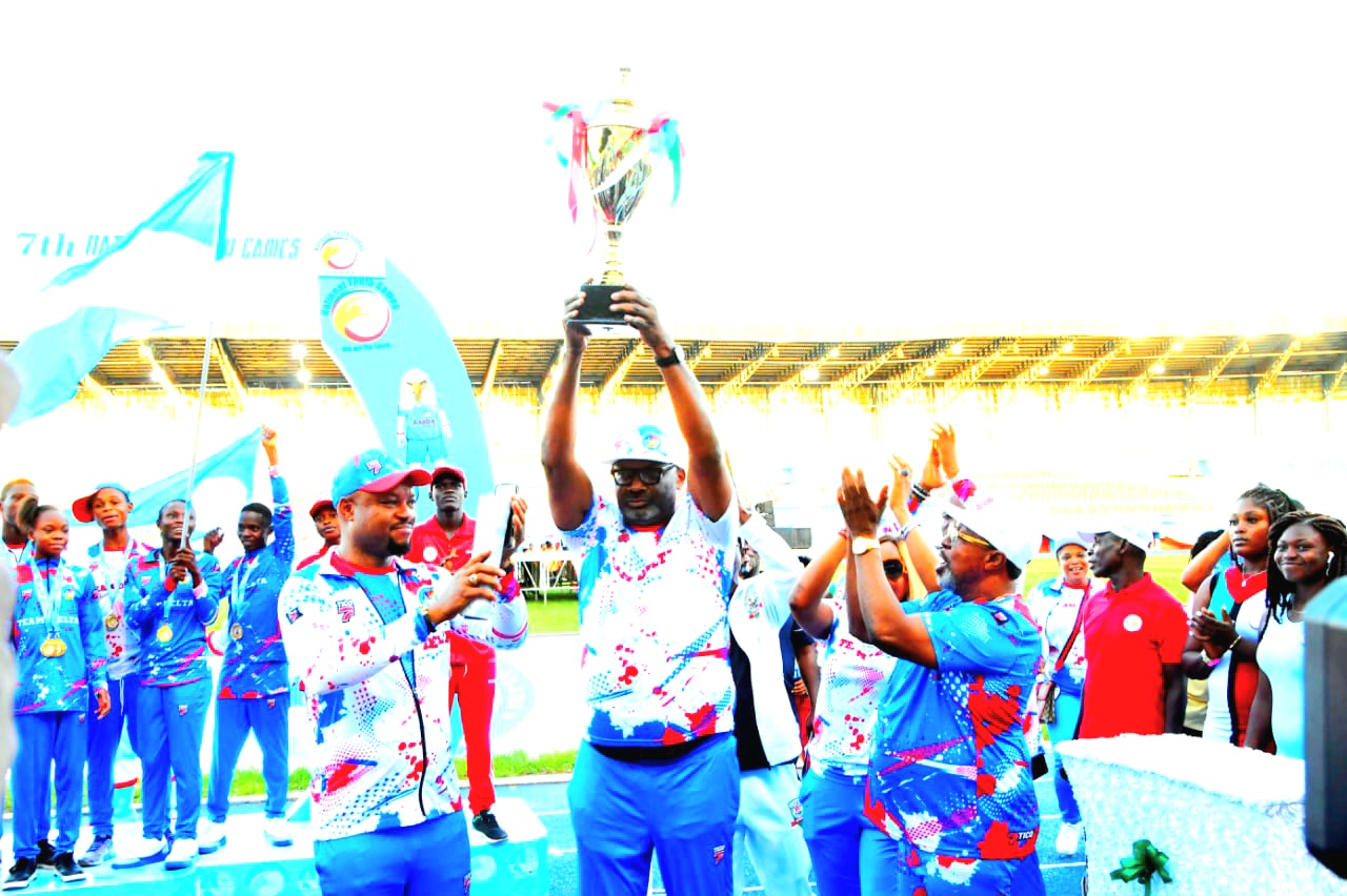 Secretary to Government, and representative of Delta Governor, Dr. Kingsley Emu (middle), displays the winner’s Trophy won by Delta State at the closing of the 7th Edition of National Youth Games held at Stephen Keshi Stadium, Asaba on Saturday, September 30 2023. with him are the Majority Leader, State House of Assembly, Hon Emeka Nwobi (left), and the Chairman, Delta State Sports Commission, Chief Tonobok Okowa (right). Pix: Enarusai Bripin