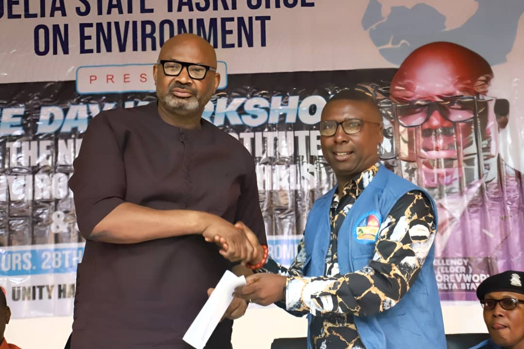 Secretary to Delta State Government (SSG), Dr Kingsley Emu (left), representing Governor Sheriff Oborevwori receiving a copy of address as presented by the Chairman, Delta State Task Force on Environment, Chief Godspower Asiuwhu during a One Day Workshop for the newly reconstituted Environmental Marshalls and Supervisors in the state in Asaba on Wednesday.