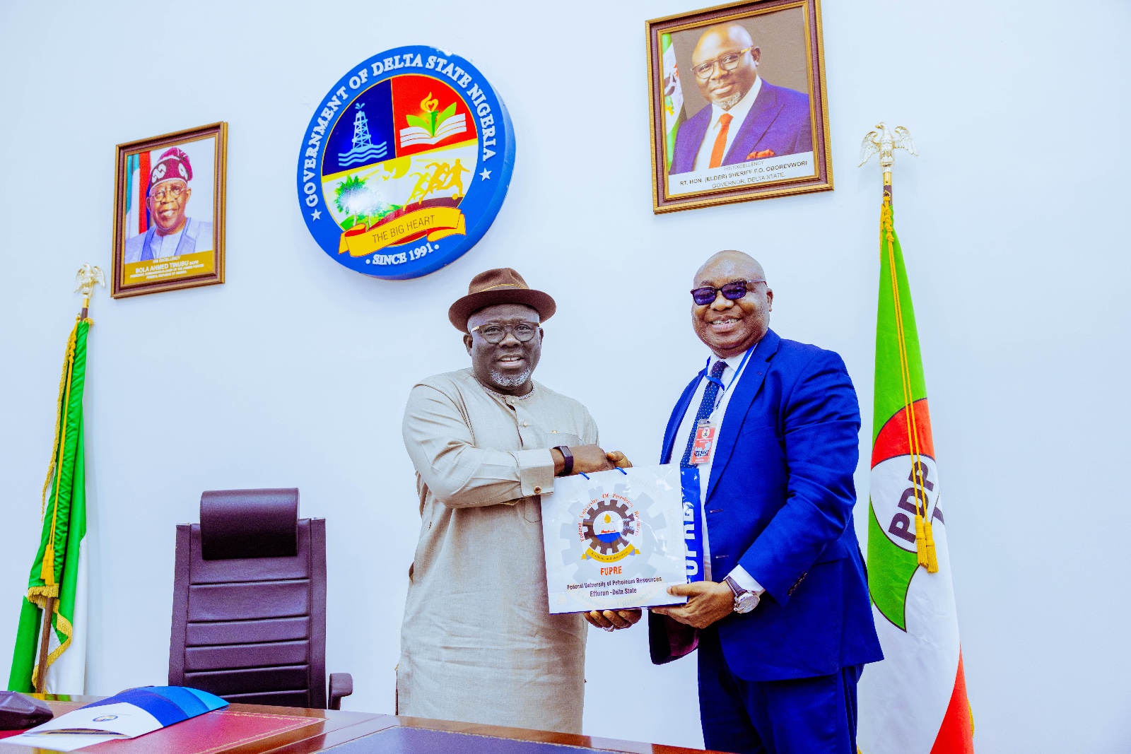 Delta Governor, Rt. Hon. Sheriff Oborevwori (left) being presented with a souvenir by the Vice-Chancellor of Federal University of Petroleum Resources,( FUPRE ), Ugbomro, Delta State , Prof. Akpofure Rim- Rukeh during a courtesy call on the Governor by the management team of the institution on Tuesday, March 12, 2024